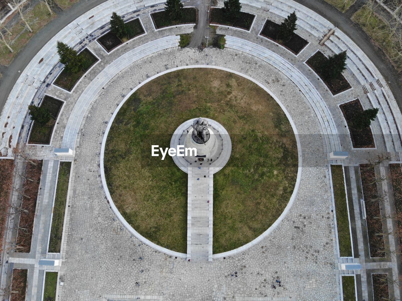 HIGH ANGLE VIEW OF CLOCK TOWER ON GRASS