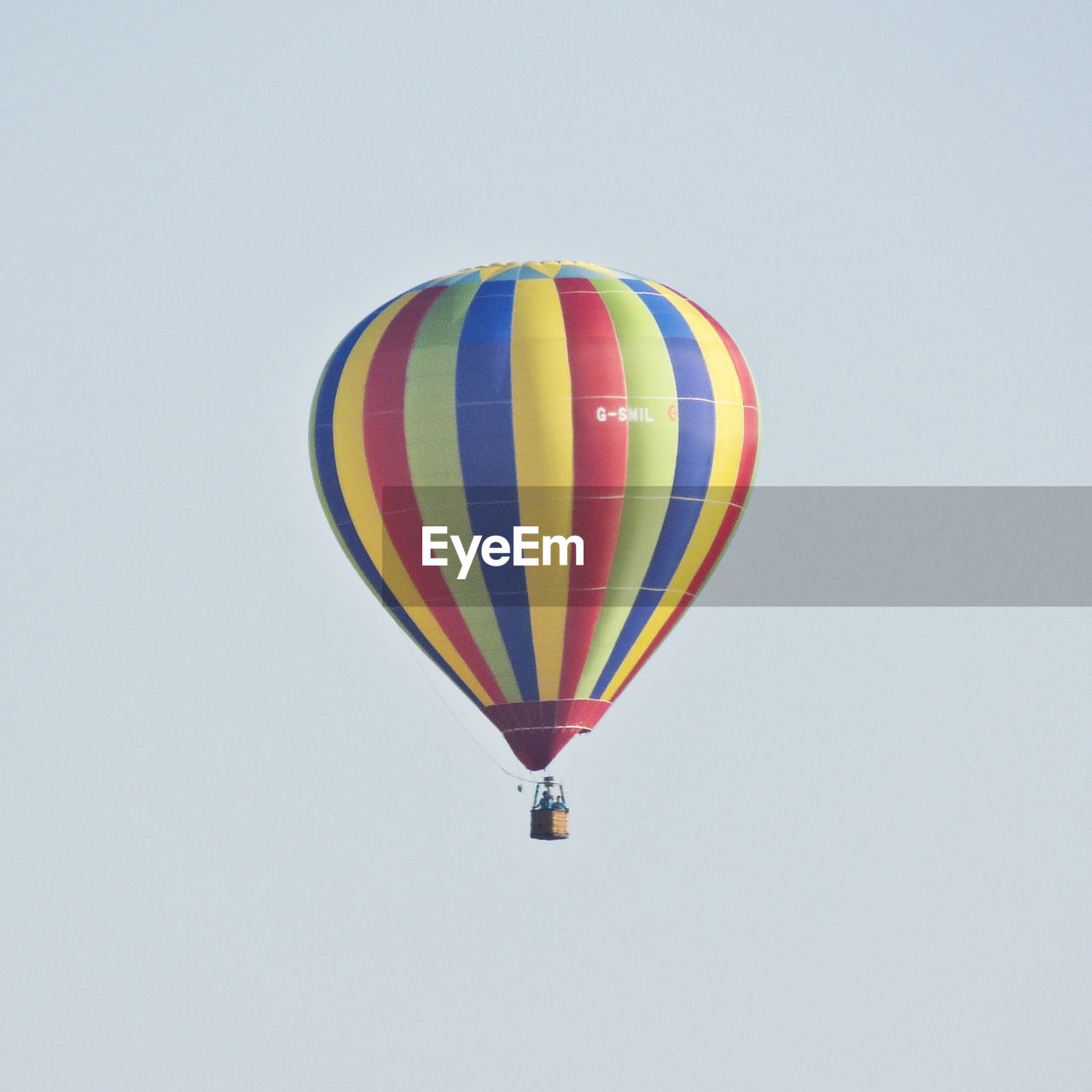 HOT AIR BALLOONS FLYING AGAINST CLEAR SKY