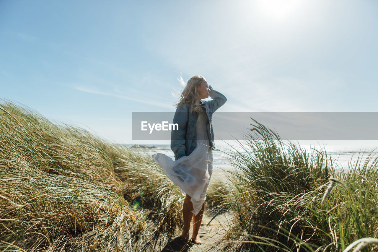 Young woman standing on beach