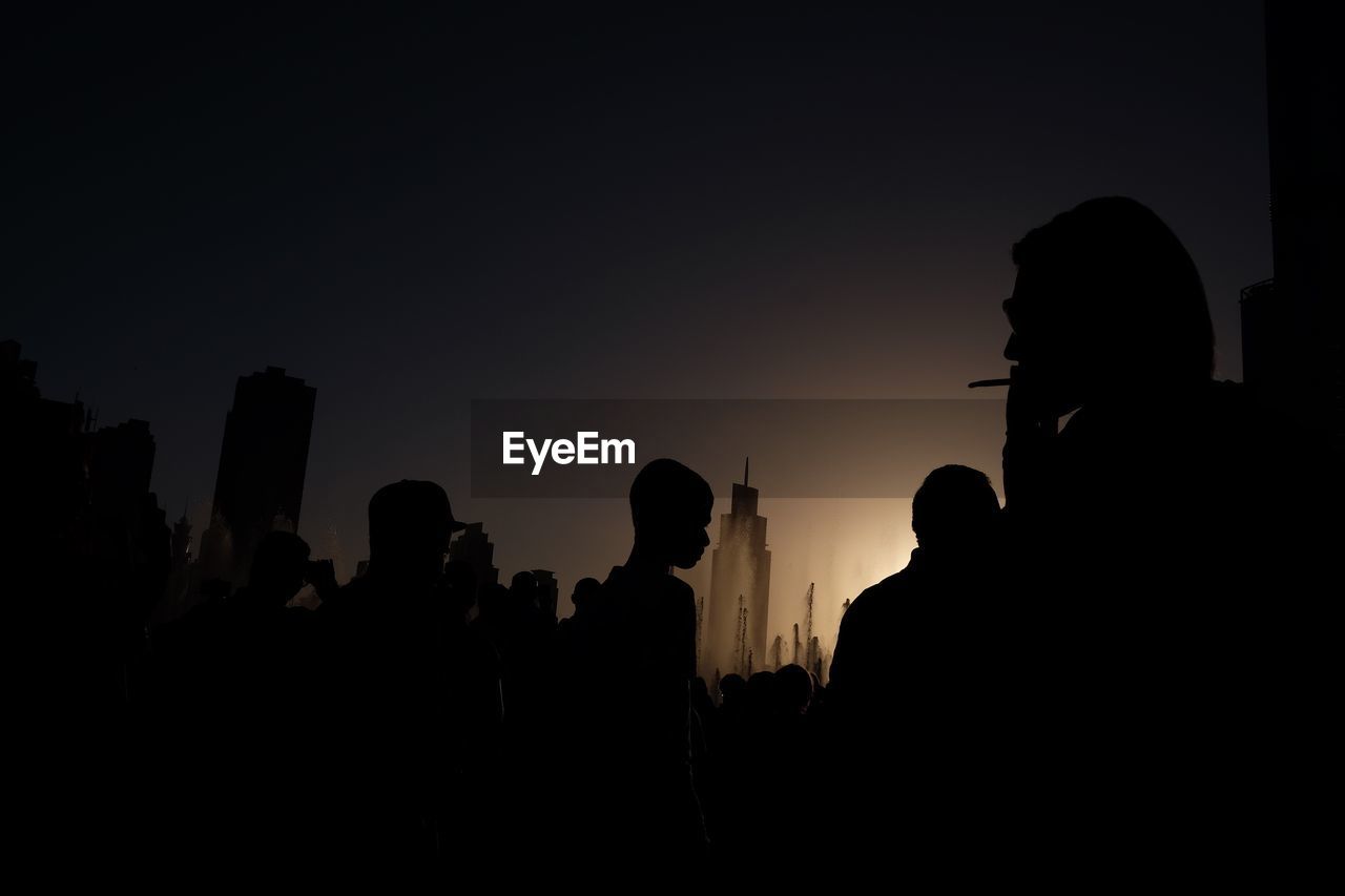 SILHOUETTE OF PEOPLE AGAINST SKY DURING SUNSET