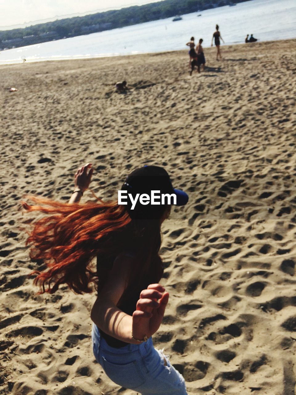 Rear view of girl on beach
