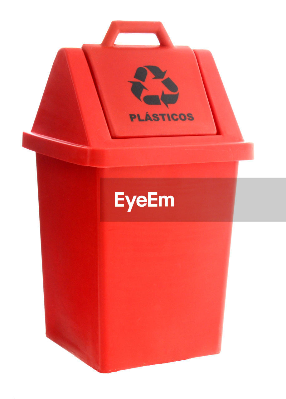 Red recycle bin against white background