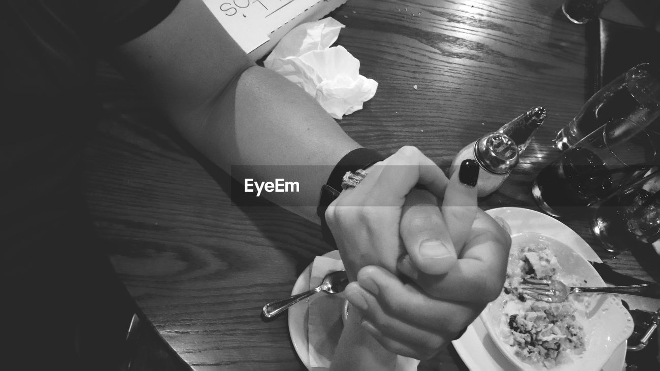 >Cropped Image Of Couple Holding Hands At Id 84500665