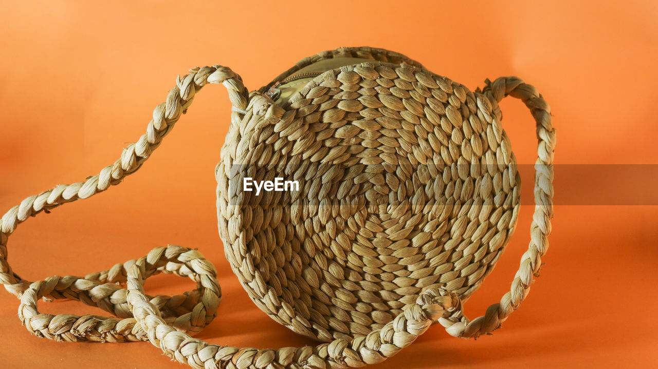 CLOSE-UP OF BASKET ON TABLE