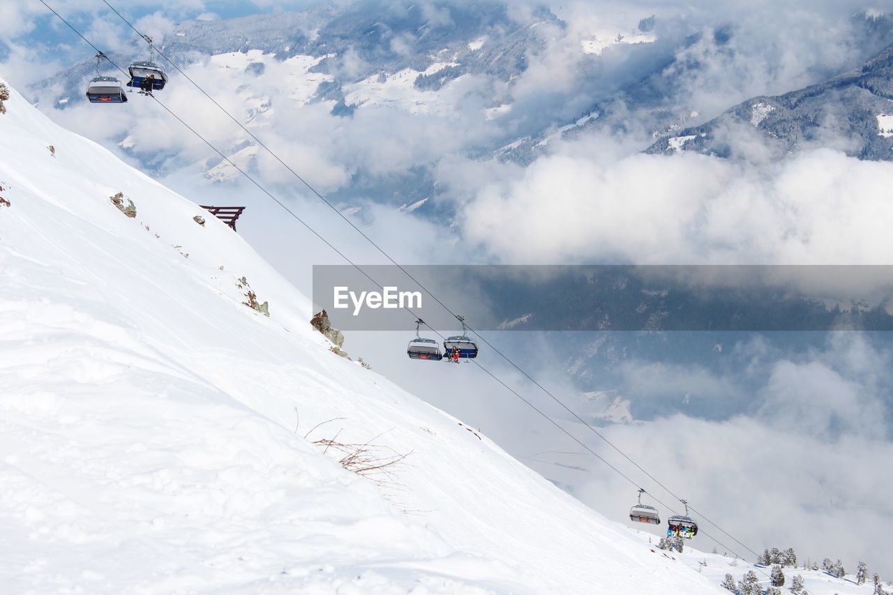 Low angle view of ski lift against mountains