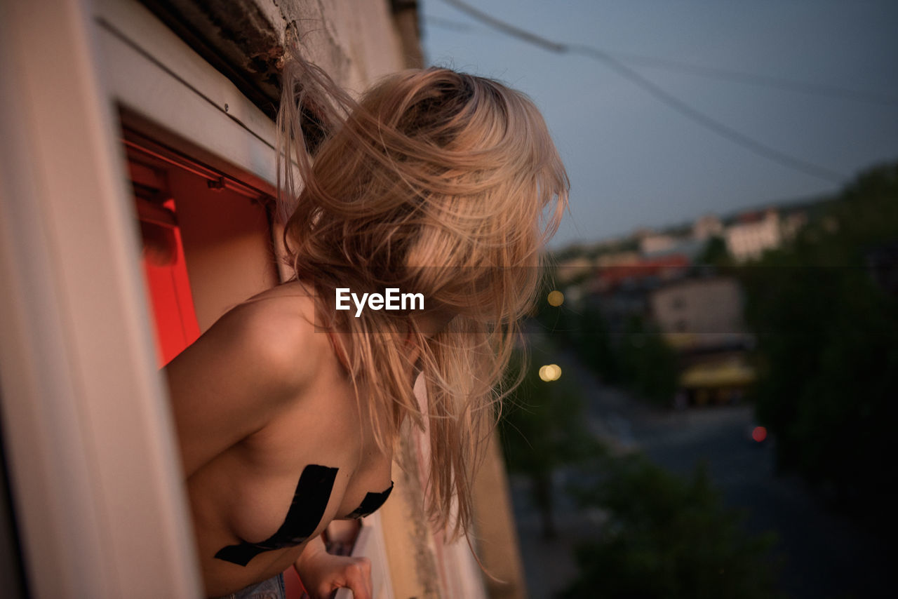 Woman leaning out from window