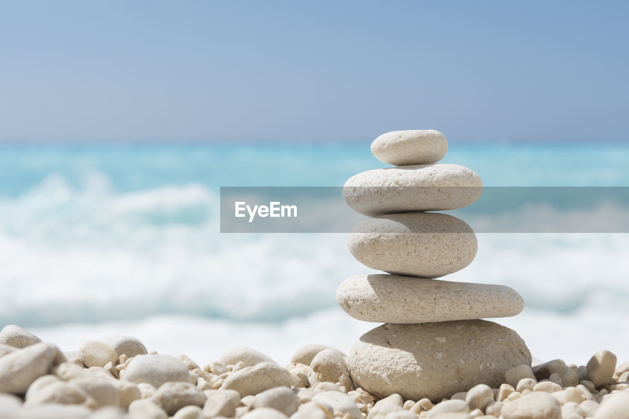 Balanced Stones On A Pebble Beach Coastline On Eyeem
