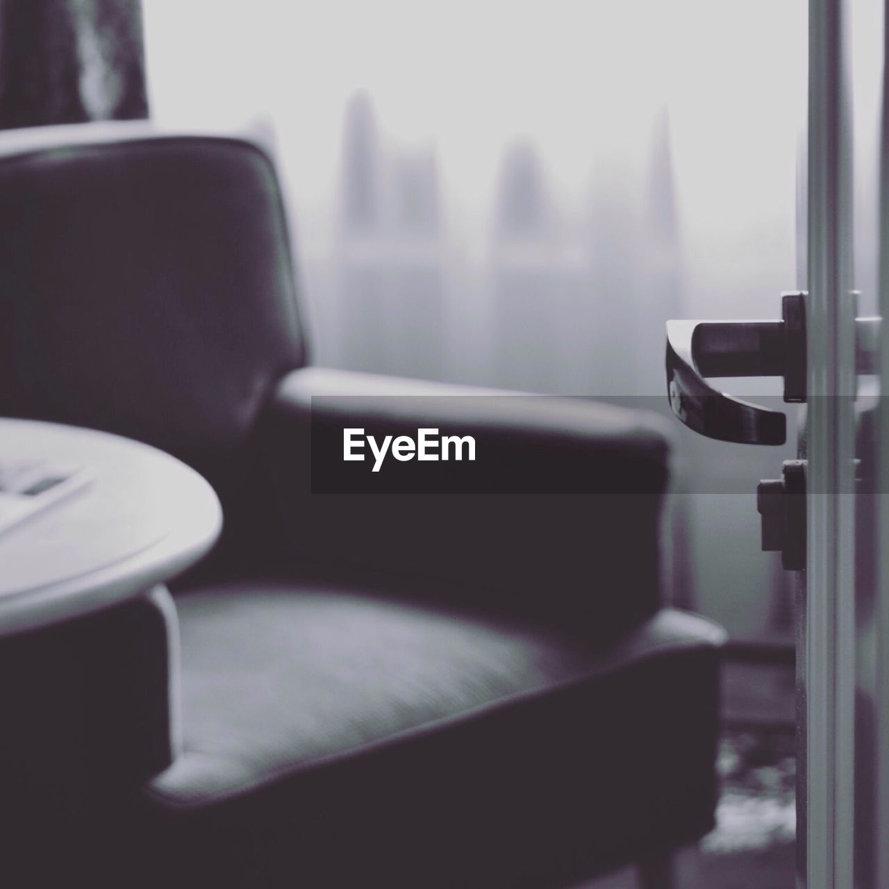 Empty chair against the window