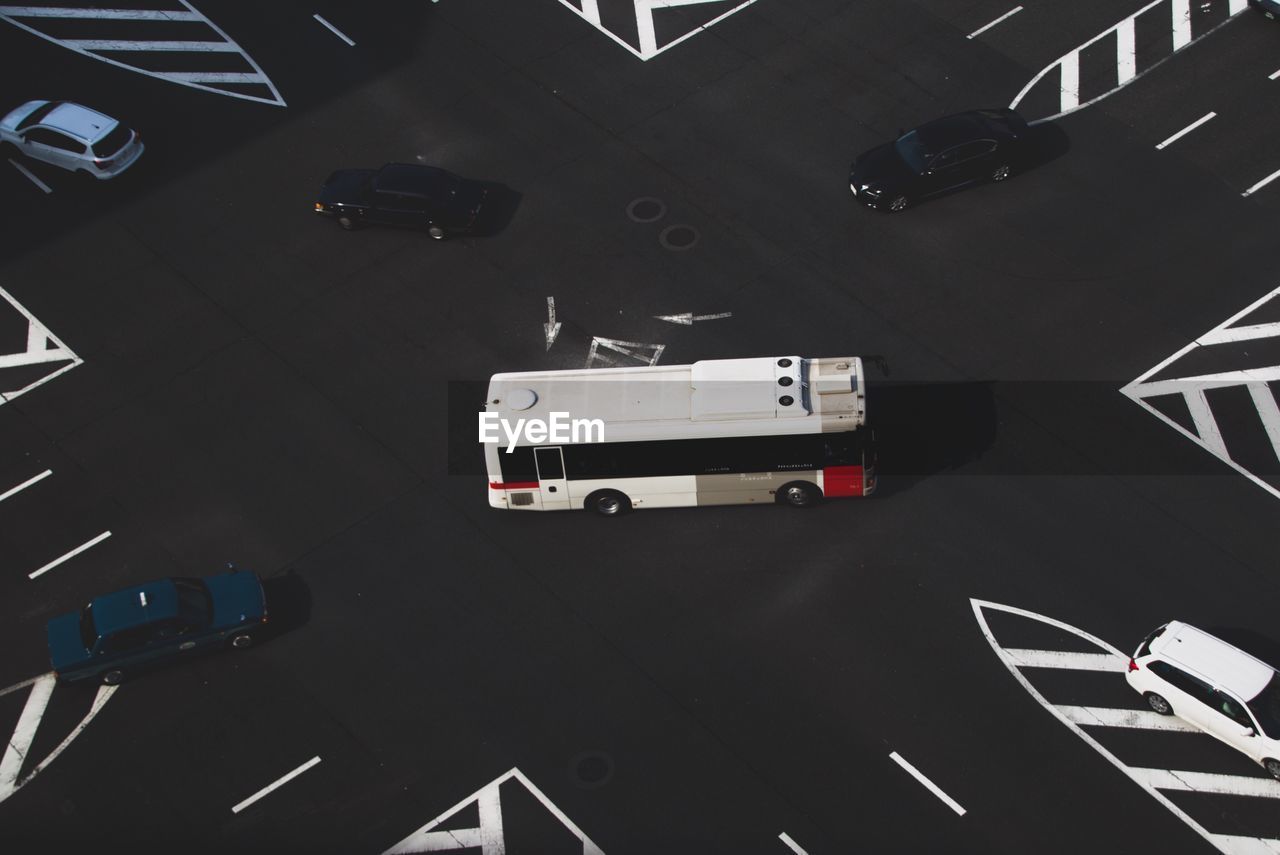 High angle view of bus and cars in parking lot