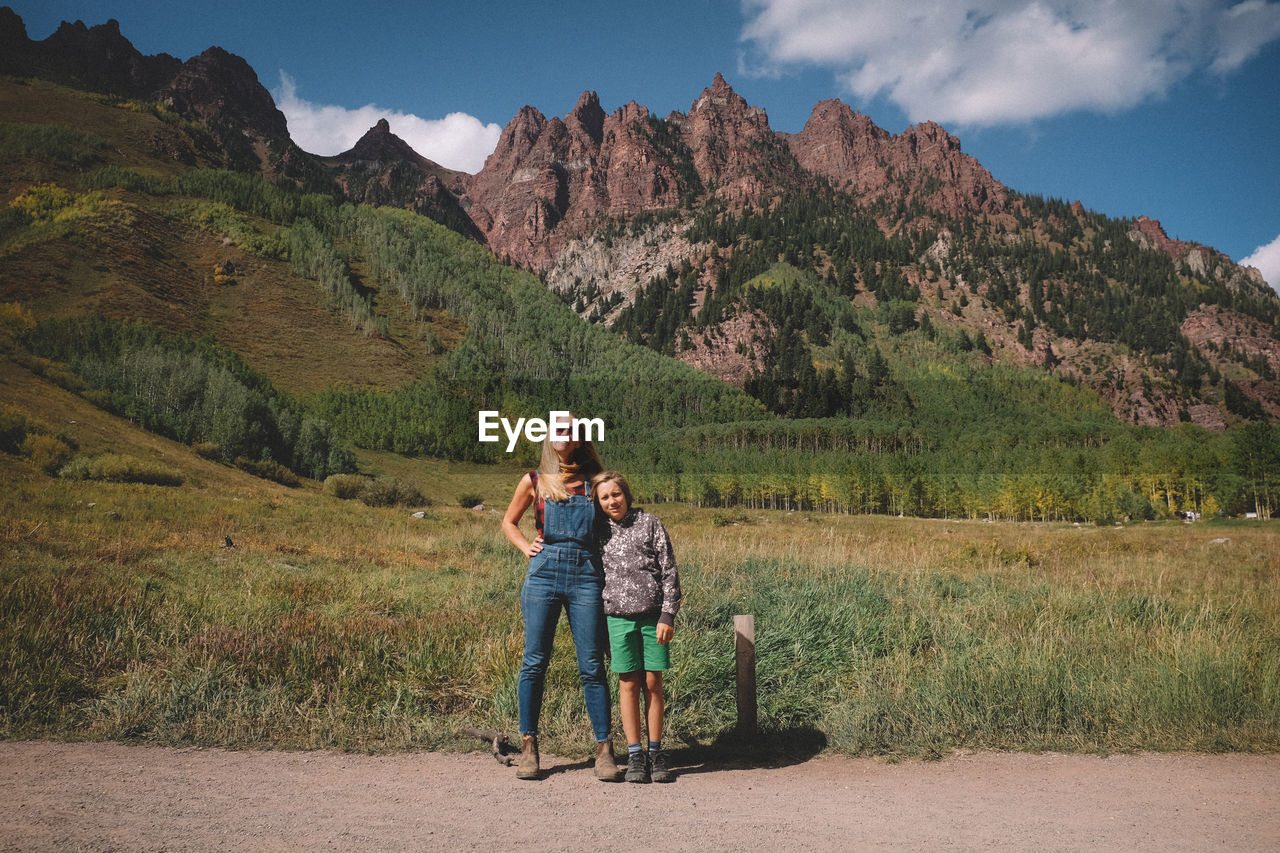 Mother and son standing in front of seivers mountain south on a sunny