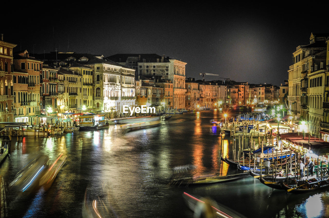 Grand canal amidst buildings at night