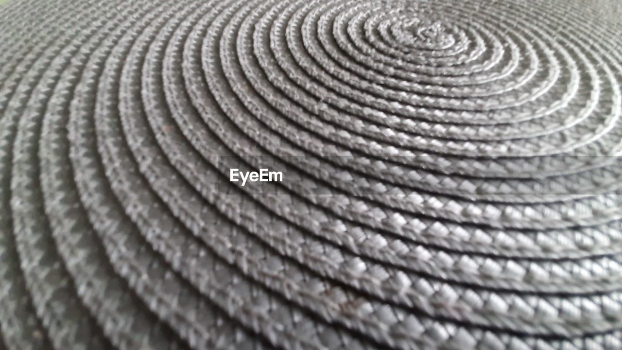 FULL FRAME SHOT OF SPIRAL PATTERN ON TEXTURED SURFACE