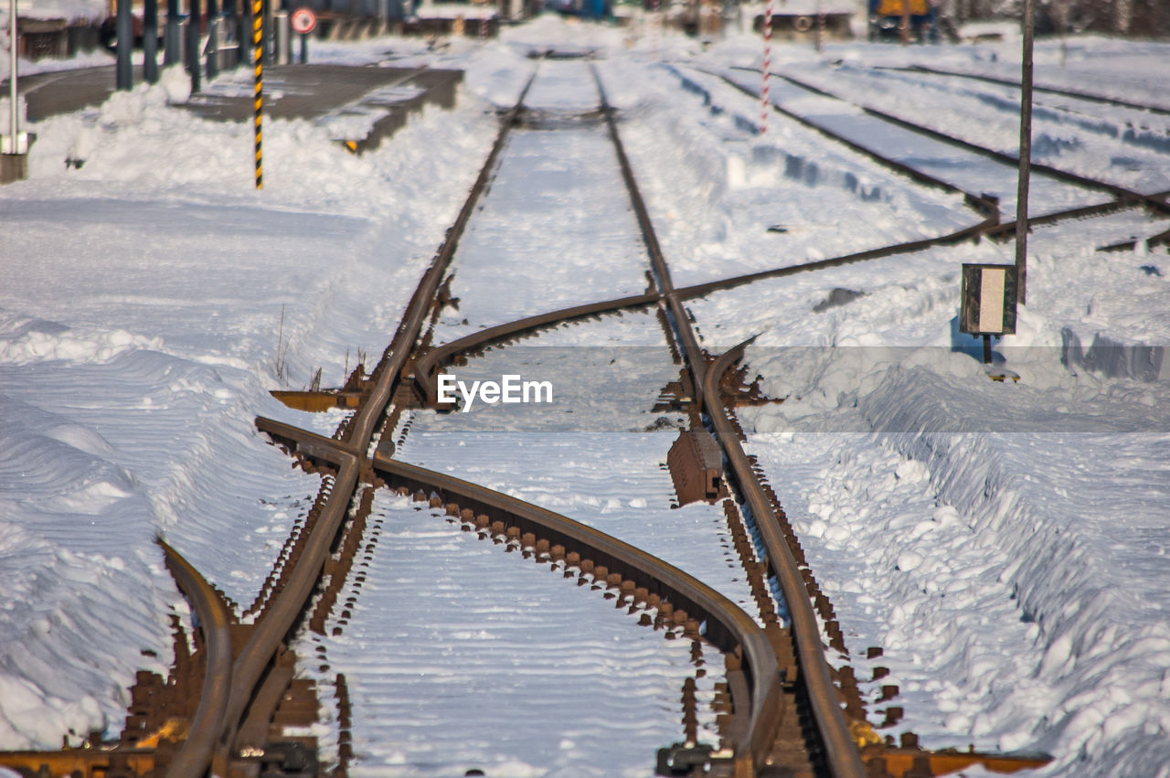 High angle view of frozen railway tracks  during winter