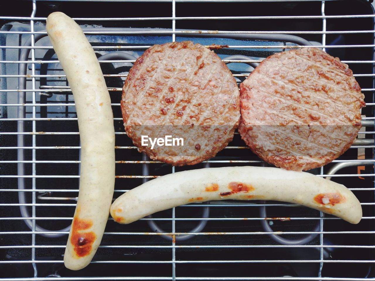 CLOSE-UP OF MEAT ON BARBECUE