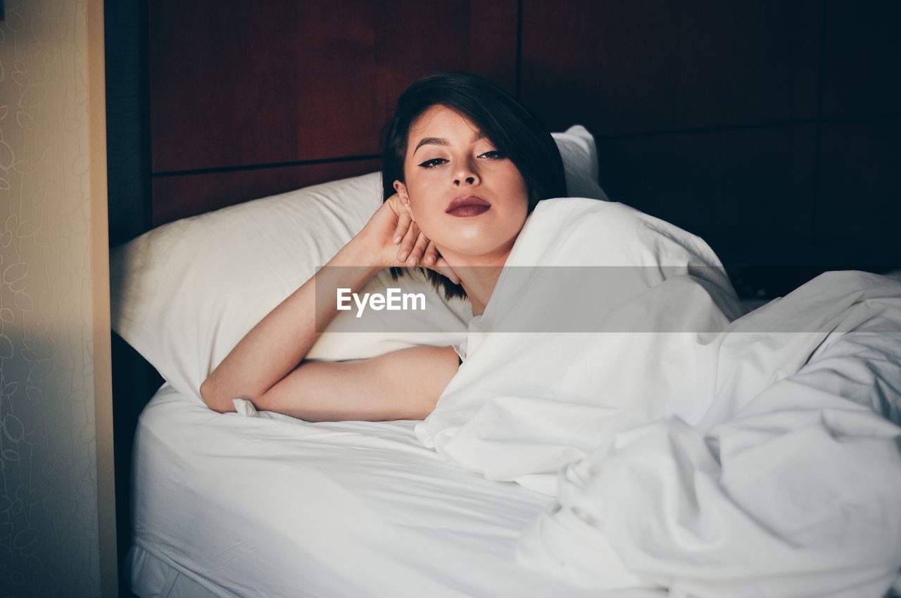 Young woman in bed