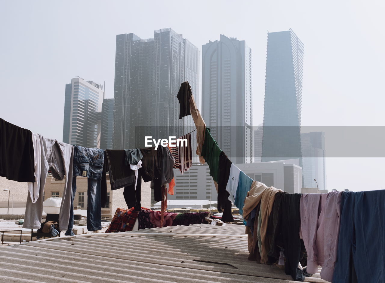 CLOTHES DRYING AGAINST BUILDINGS IN CITY