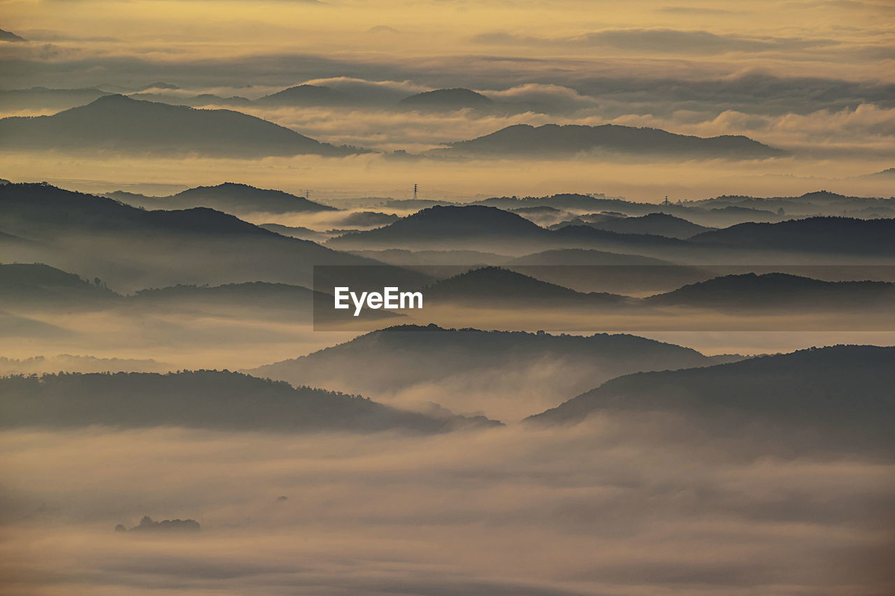 Scenic view of mountains against sky during sunset
