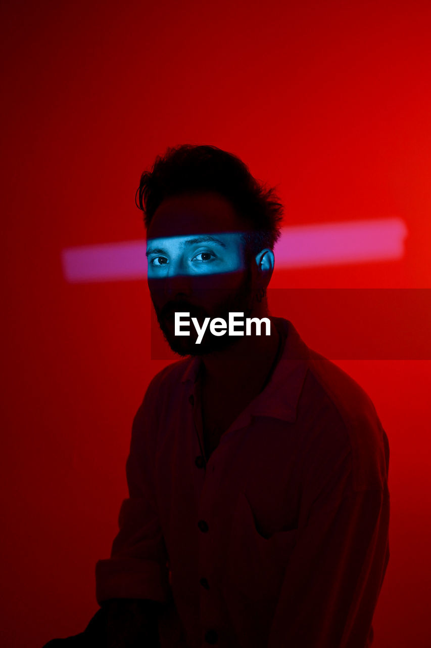 Portrait of man with mask of light