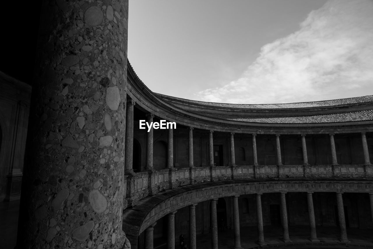 Black and white low angle view of the alambra against sky