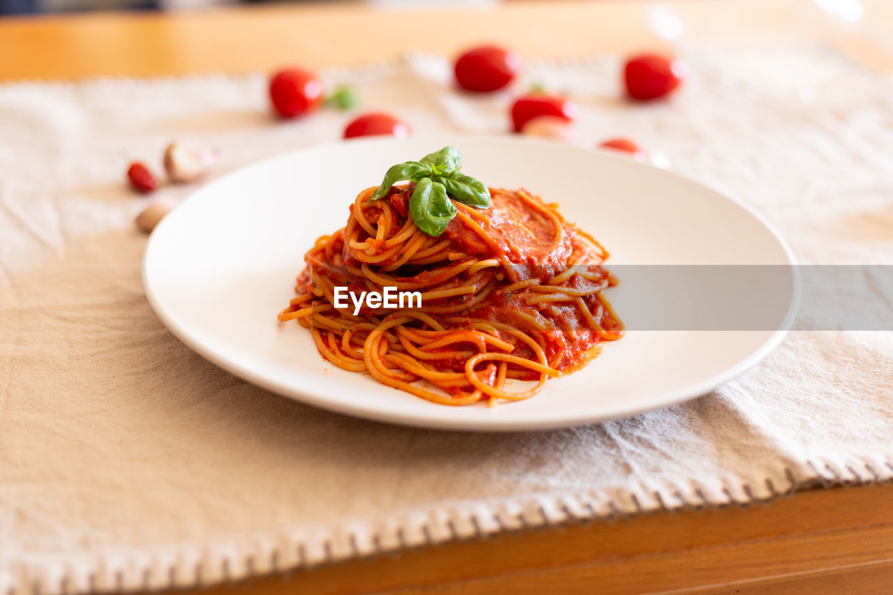 Italian spaghetti with tomato sauce, basil and extra virgin olive oil