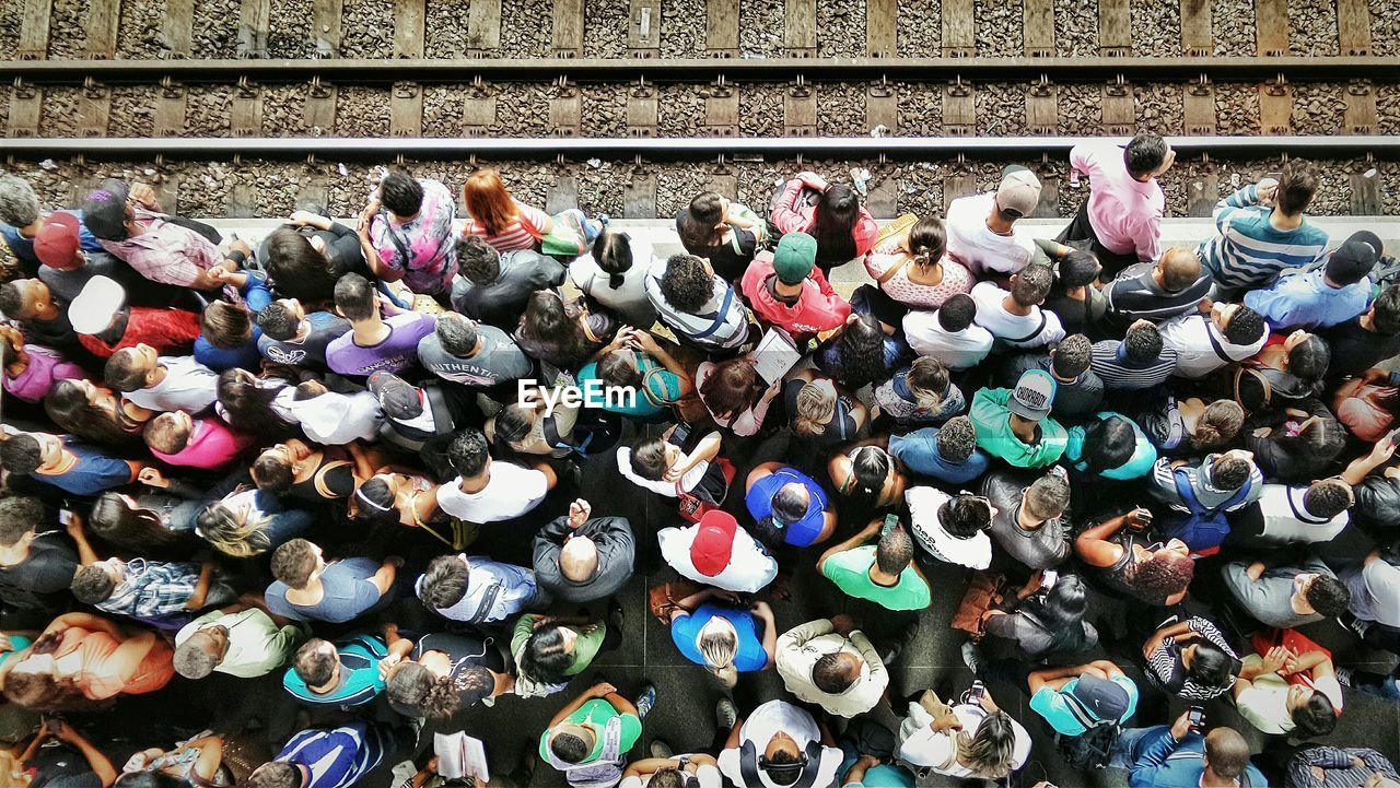 Directly above shot of people waiting at railroad station