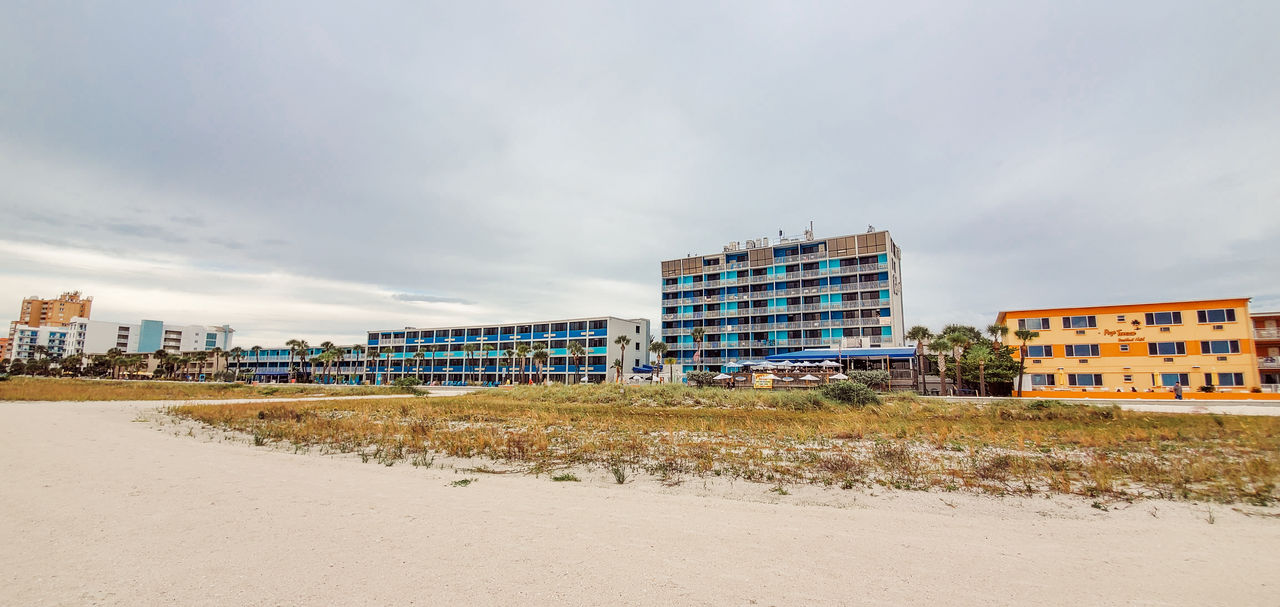 architecture, beach, built structure, building exterior, sky, land, building, sea, city, coast, nature, cloud, sand, shore, water, outdoors, no people, landscape, walkway, travel destinations, horizon, environment, residential district, urban area, boardwalk, day, construction industry, travel, copy space, apartment