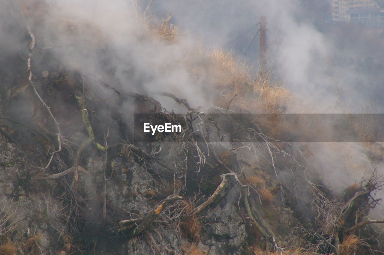 Smoke emitting from volcanic mountain