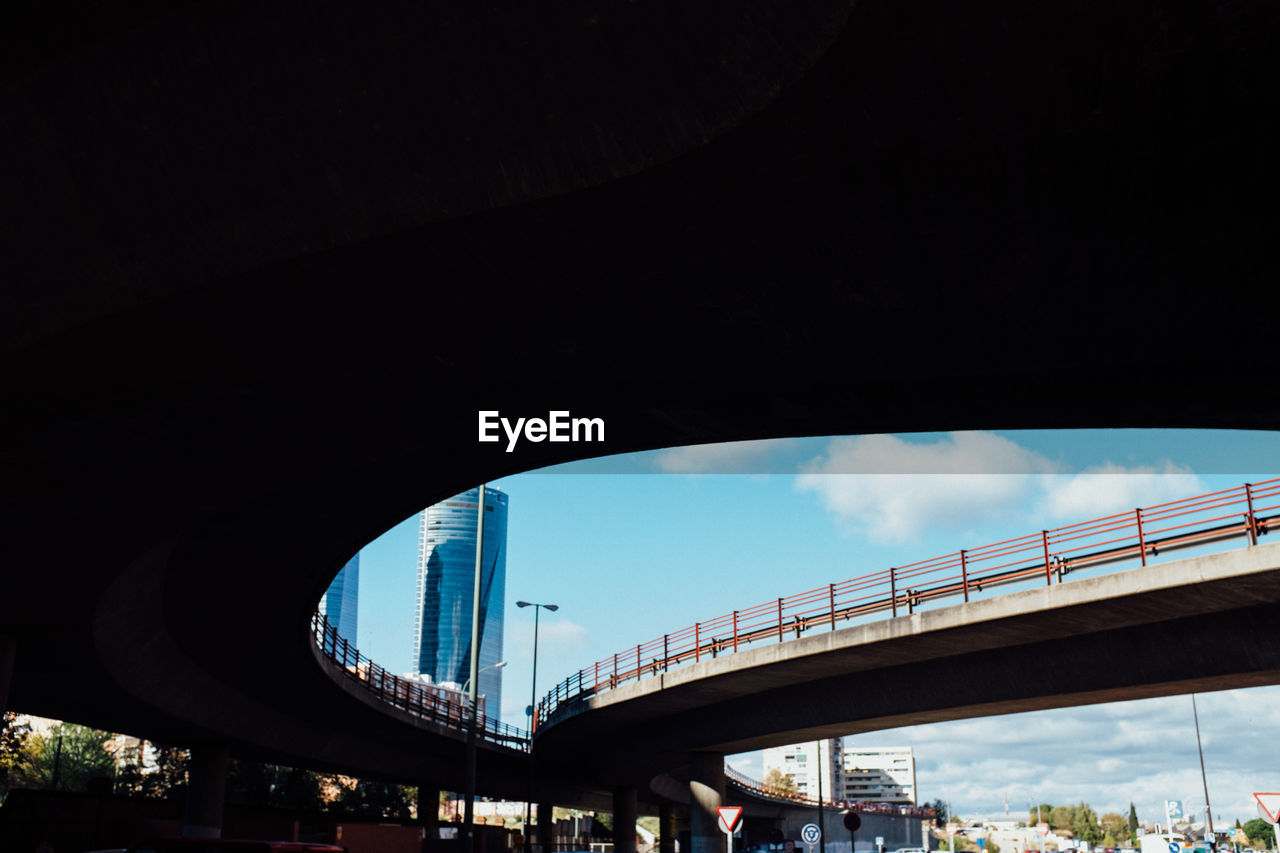 Low angle view of bridges in city