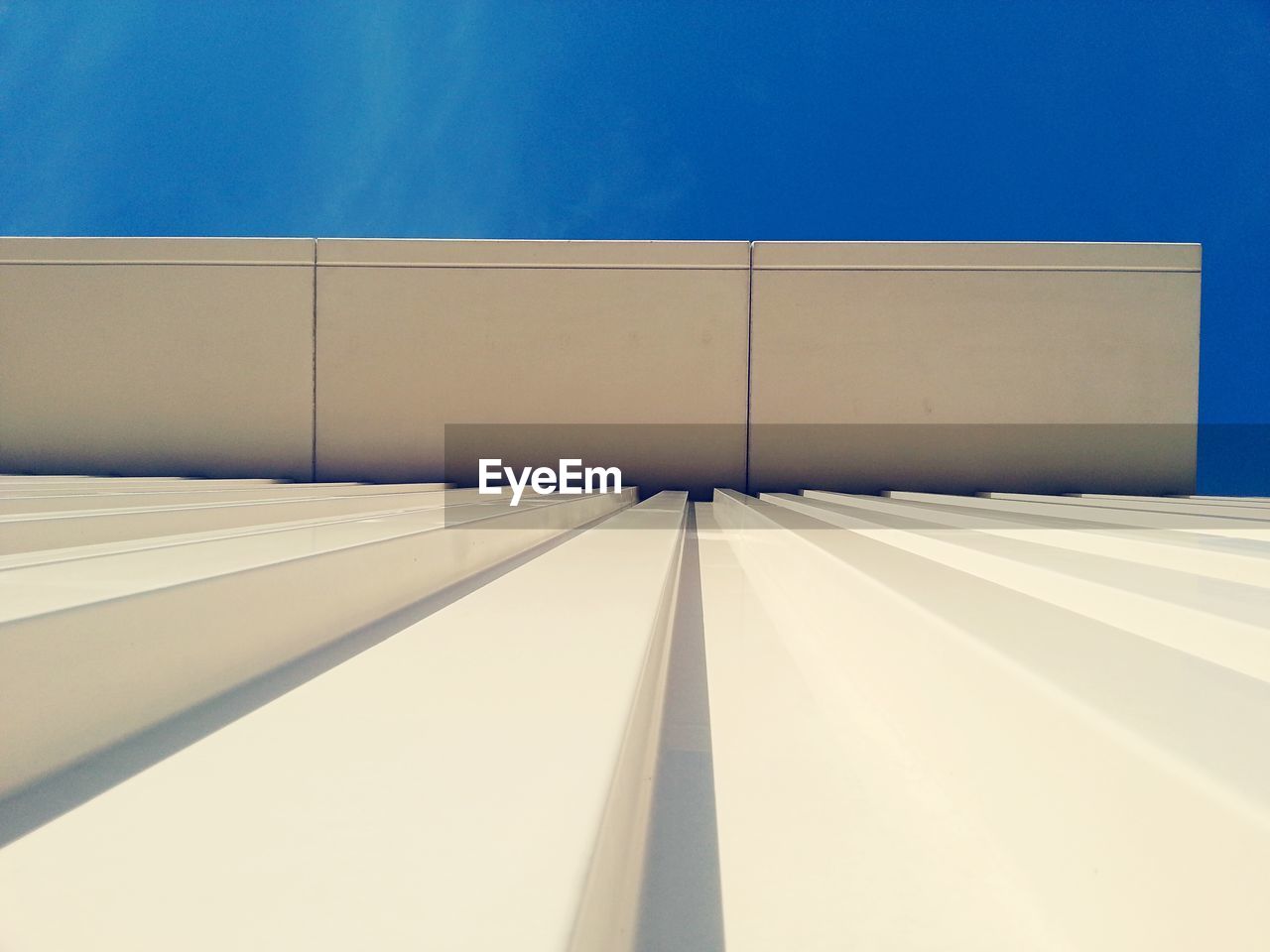 Low angle view of building against blue sky
