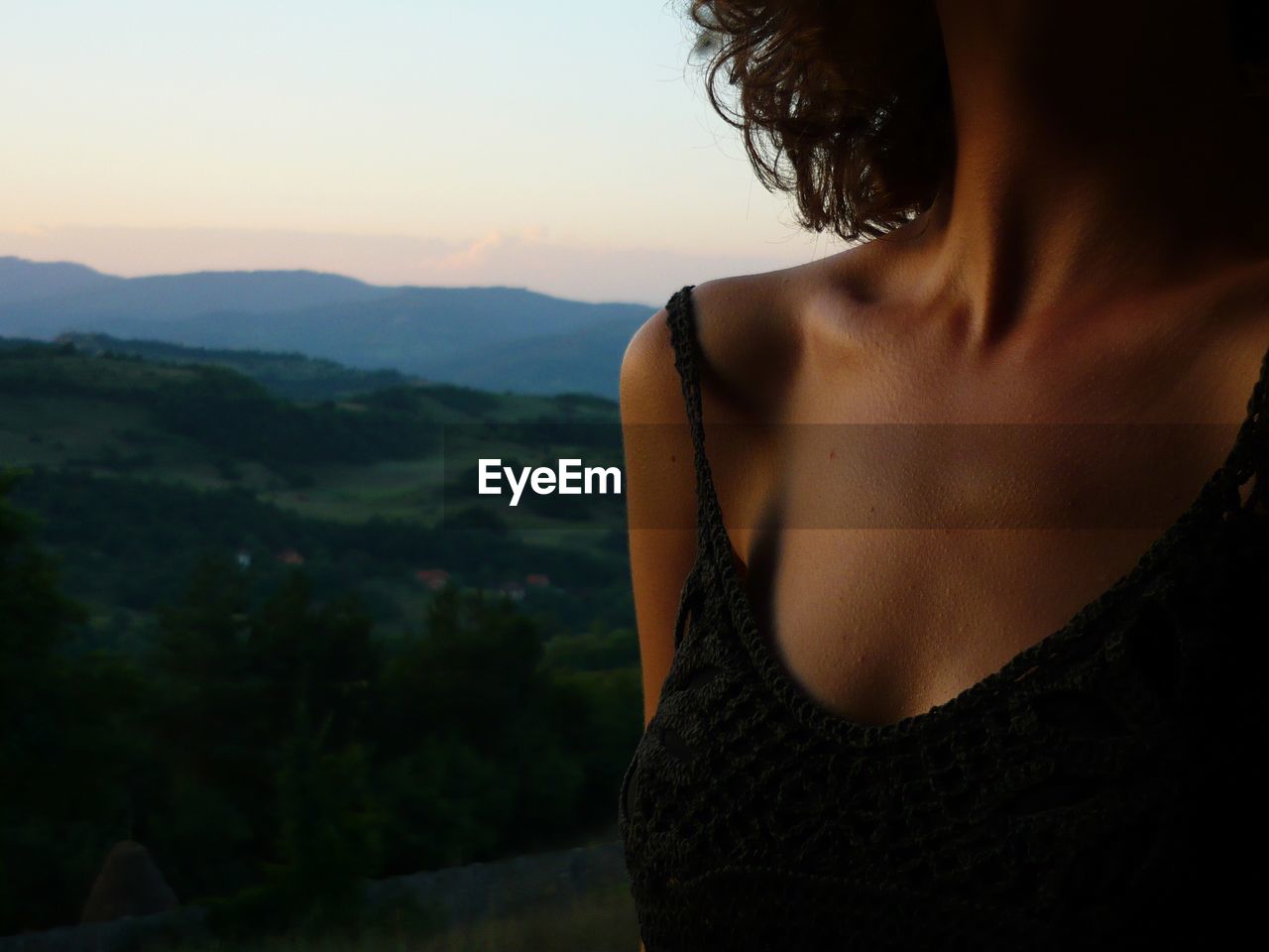 Midsection of woman during sunset