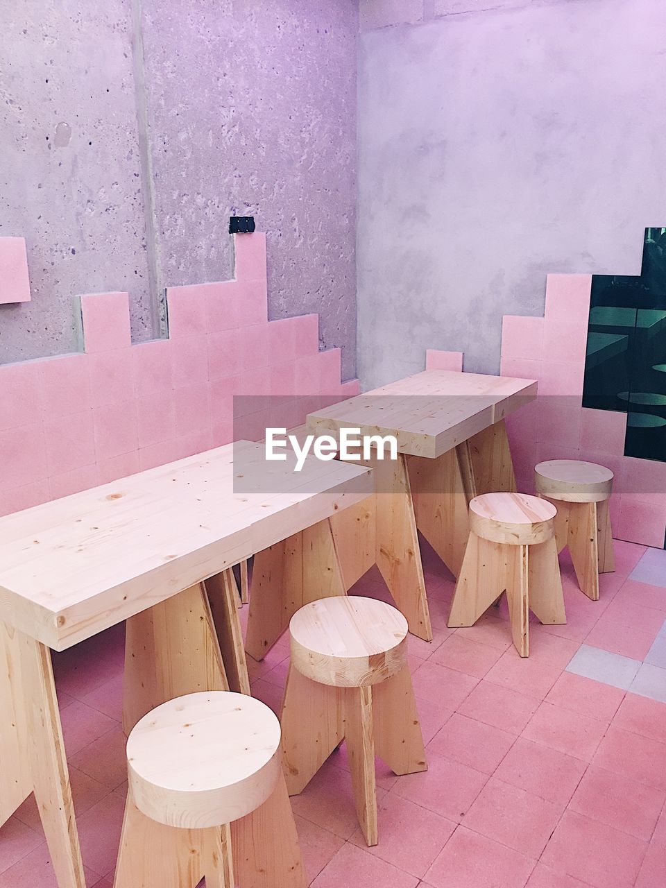 HIGH ANGLE VIEW OF PINK UMBRELLA ON WALL