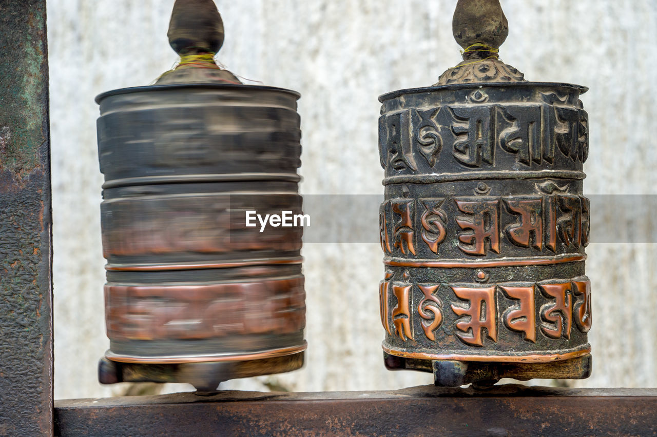 Close-up of prayer wheel at temple