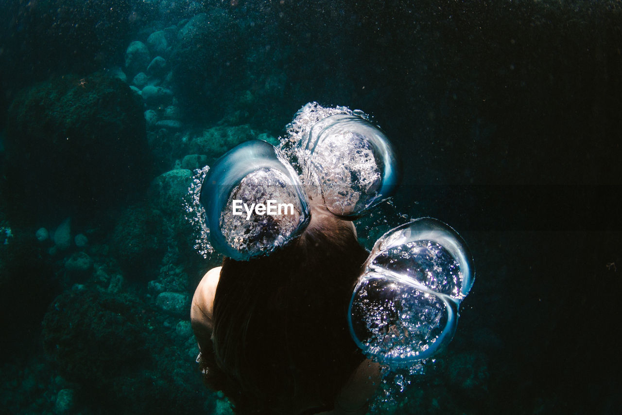 High Angle Of Woman Swimming Underwater In Sea On Eyeem