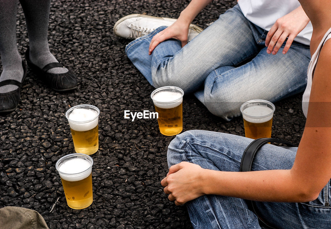 High angle view of friends with beer glasses