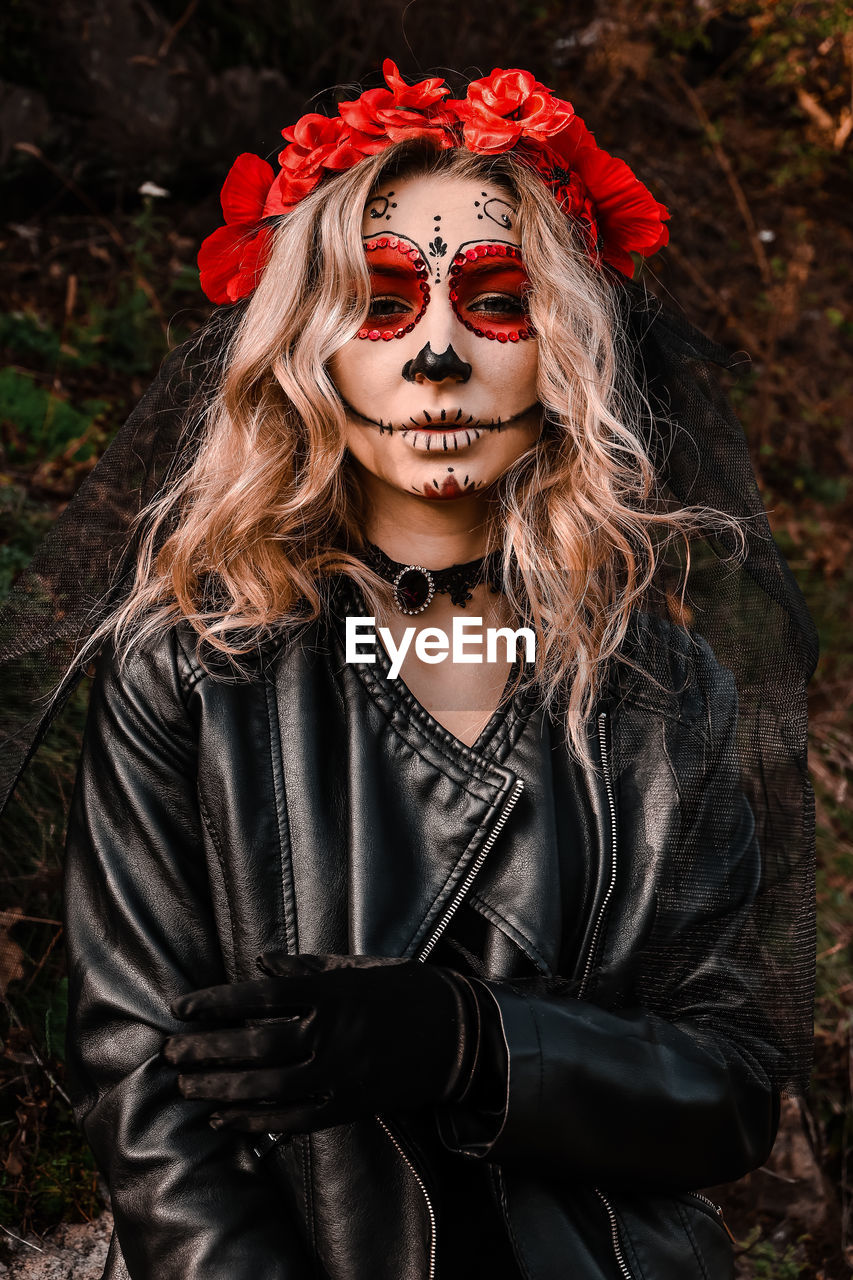 Closeup portrait of calavera catrina. young woman with sugar skull makeup. dia de los muertos. day 