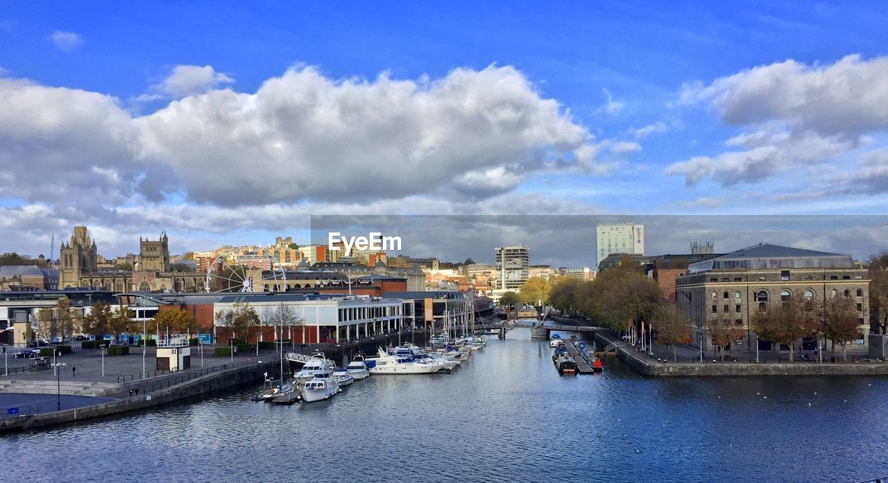 Panoramic view of river and buildings against sky