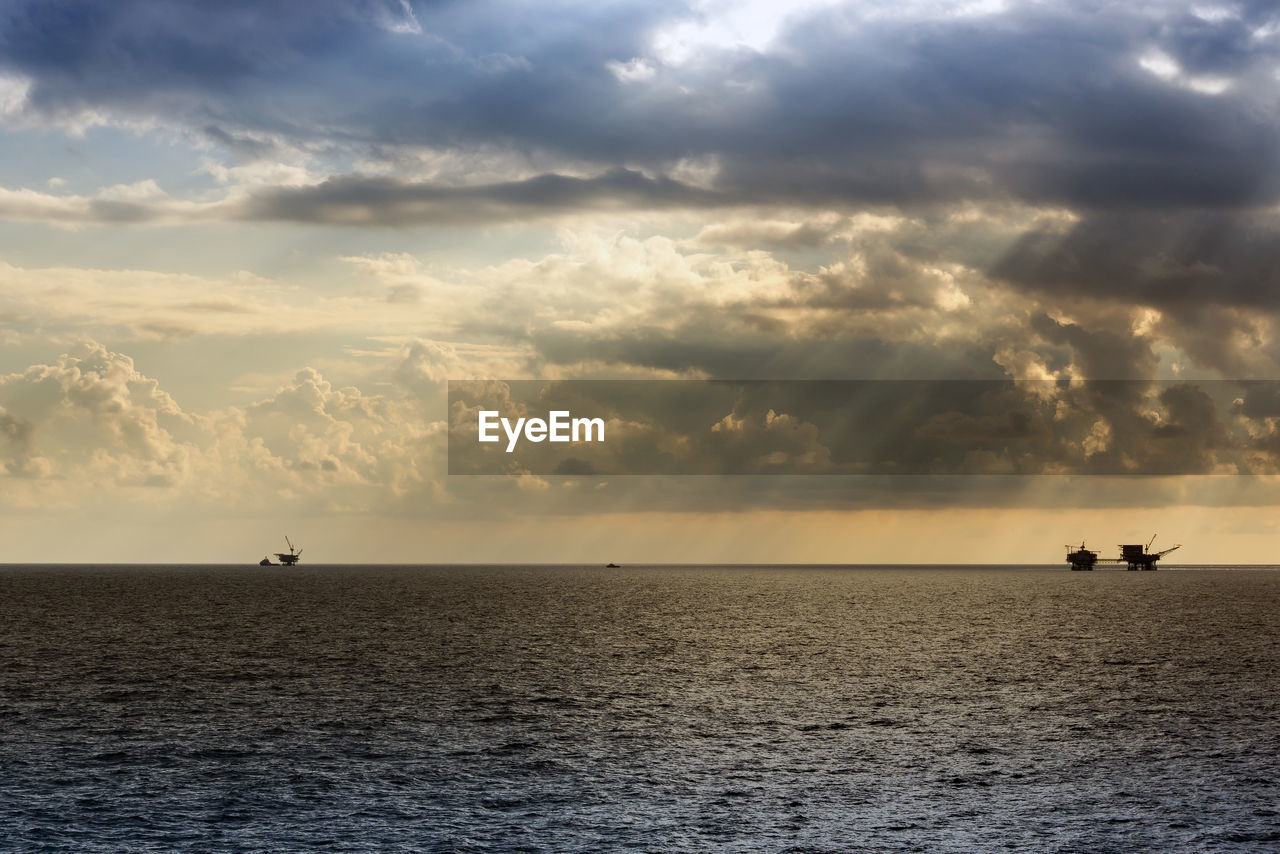Seascape of sunset at offshore oil field