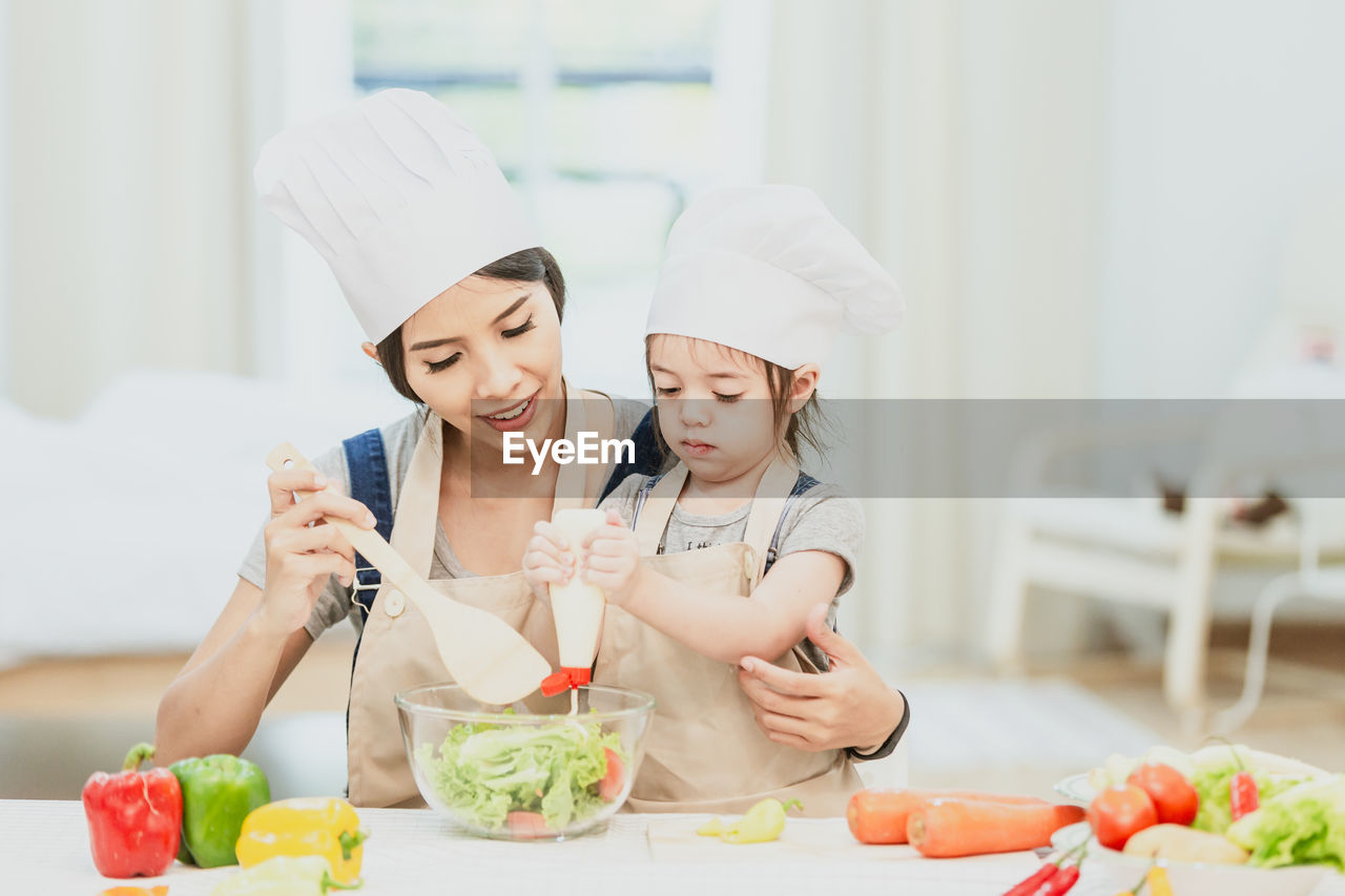 YOUNG WOMAN HOLDING FOOD