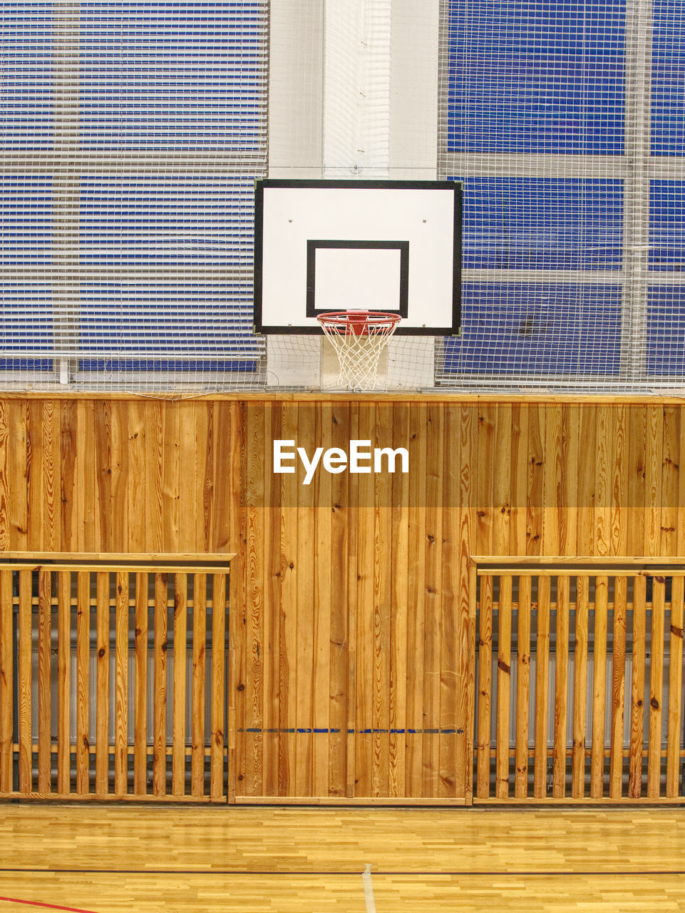 School gym with basketball board and basket. basketball hoop in the high school gym