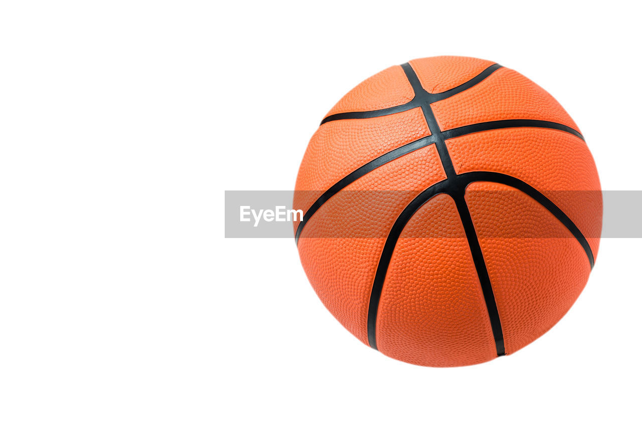 Close-up of basketball against white background