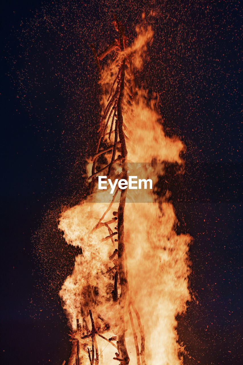Close-up of wood burning against black background