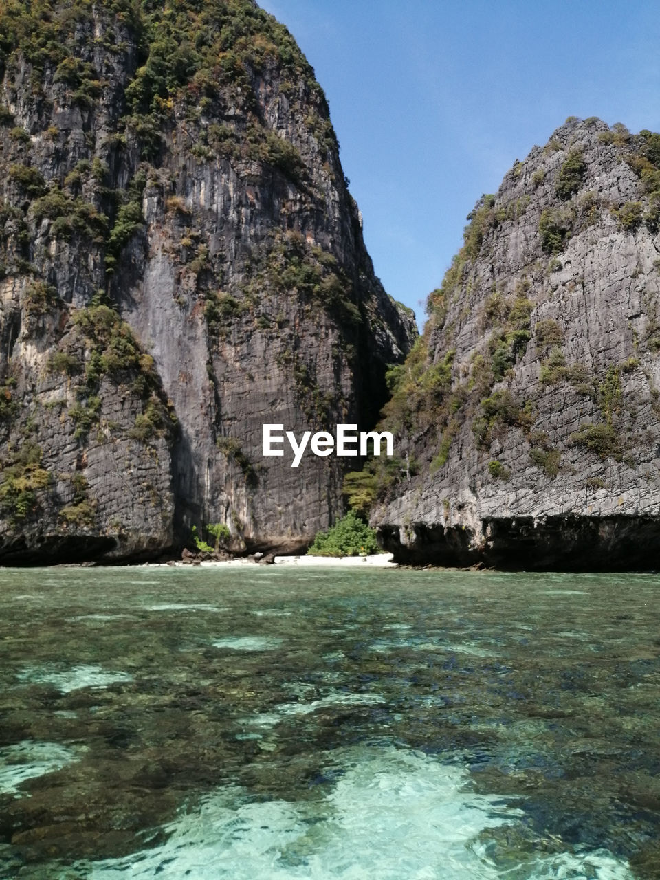 Rock formation by sea against sky in phi phi lagoon 