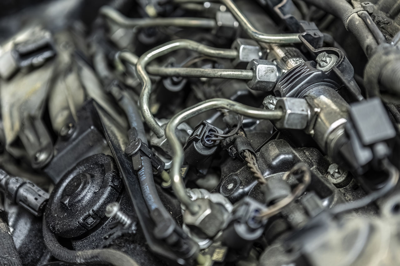 metal, selective focus, close-up, engine, no people, large group of objects, backgrounds, firearm, machinery, full frame, indoors, abundance, chain