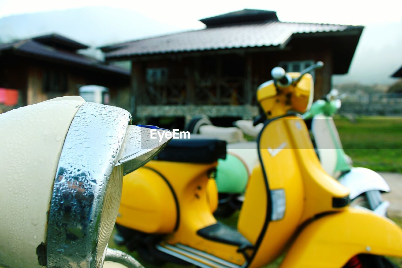 Close-up of yellow motorcycle