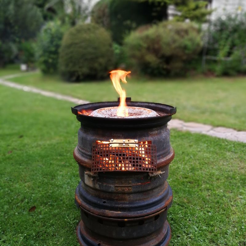 Close Up Of Burning Fire Pit On Grass Id 130307449