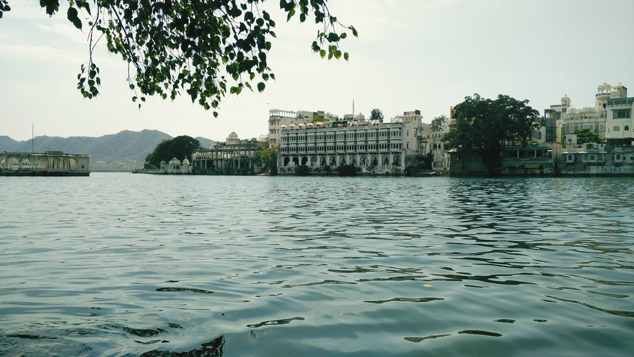 Old buildings on shore in udaipur