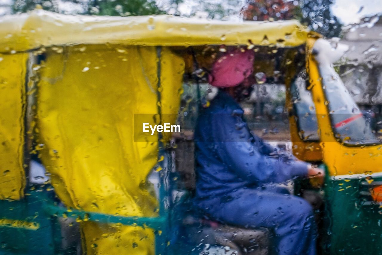 CLOSE-UP OF YELLOW VEHICLE