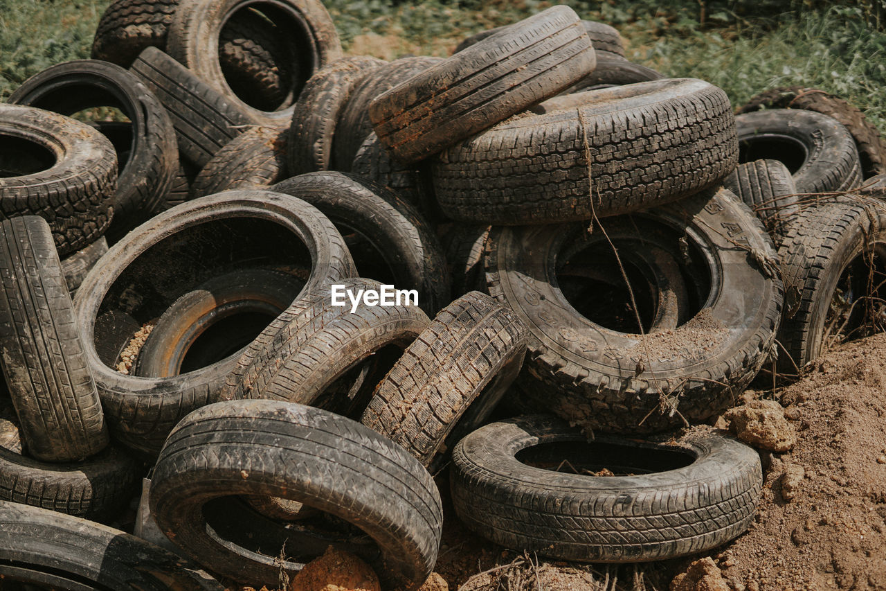 Close-up of abandoned tires at junkyard