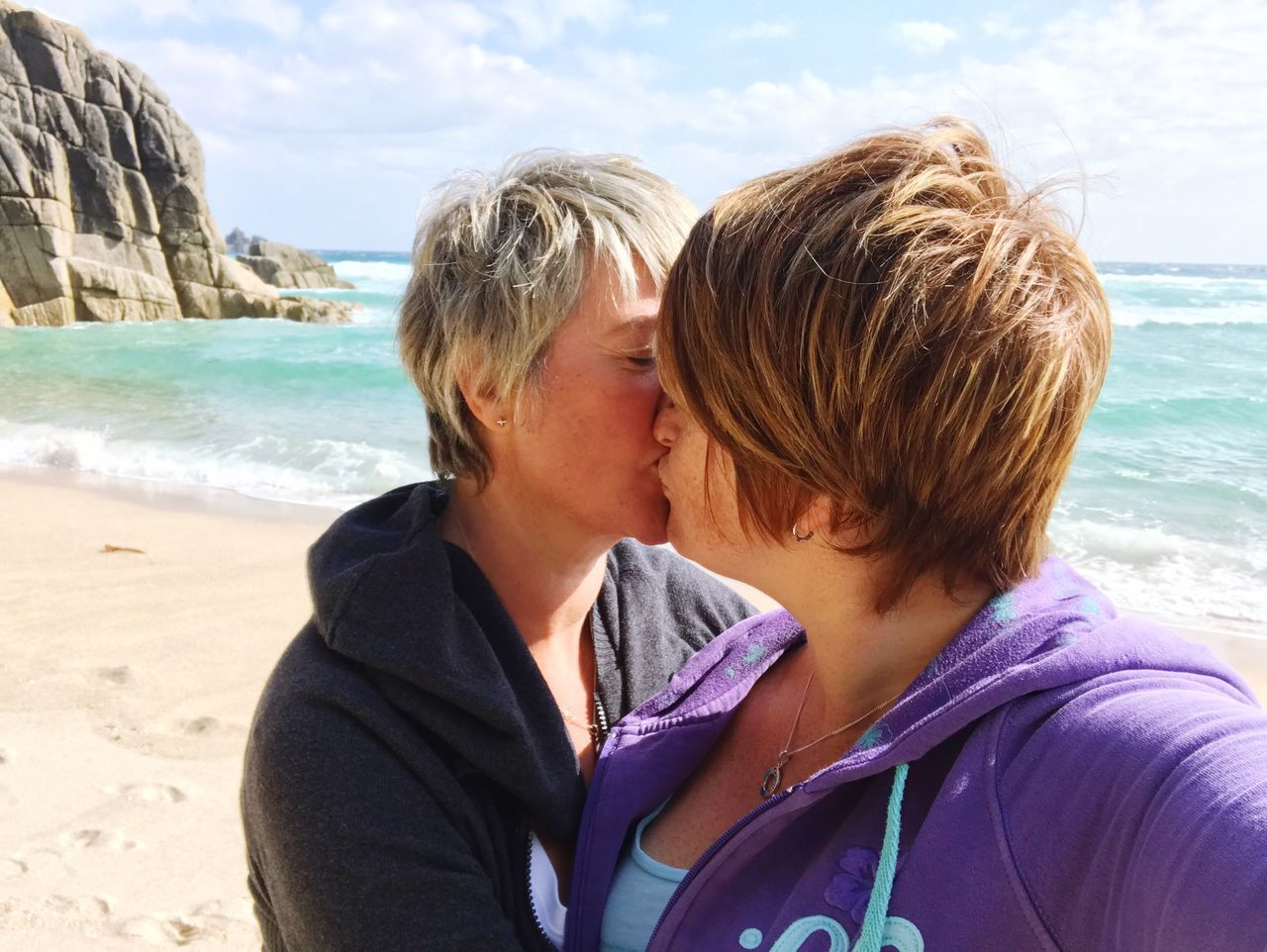 Lesbian Couple Kissing At Beach On Sunny Day Id 108936464
