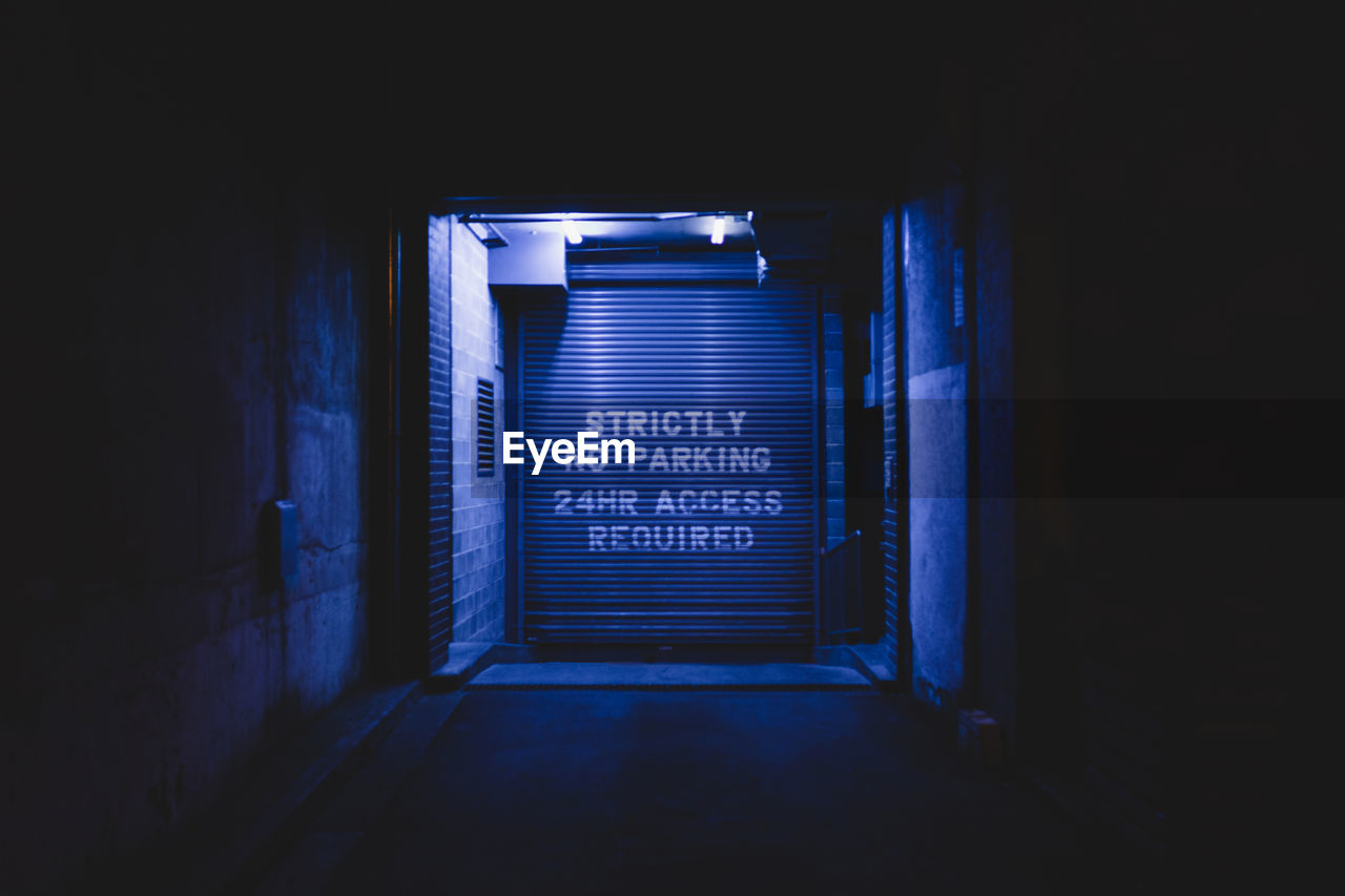 Text on shutter at night